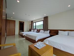 Postel nebo postele na pokoji v ubytování HỒNG HẢI 2 HOTEL