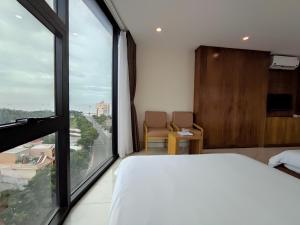 Postel nebo postele na pokoji v ubytování HỒNG HẢI 2 HOTEL