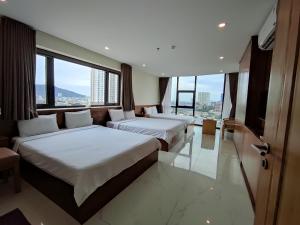 Postel nebo postele na pokoji v ubytování HỒNG HẢI 2 HOTEL