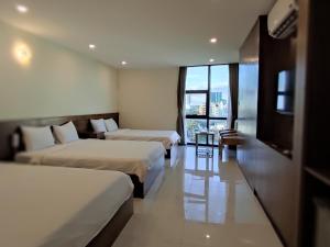 Postel nebo postele na pokoji v ubytování HỒNG HẢI 2 HOTEL