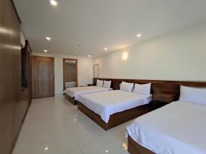 Postel nebo postele na pokoji v ubytování HỒNG HẢI 2 HOTEL