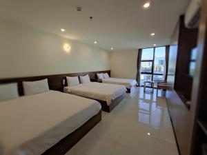 Postel nebo postele na pokoji v ubytování HỒNG HẢI 2 HOTEL