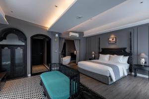 a bedroom with a large bed and a bathroom at Kim Minh Boutique in Vung Tau