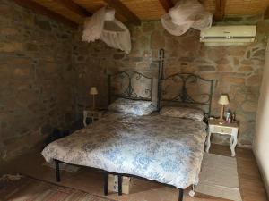 Ein Bett oder Betten in einem Zimmer der Unterkunft Villetta Sisini - Key to Villas