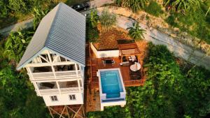 an overhead view of a house with a swimming pool at Sandy Feet Retreat in Sandy Bay