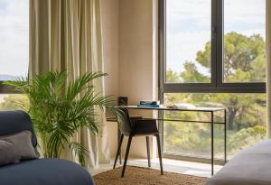 a room with a desk in front of a window at Moro Inn in Korčula