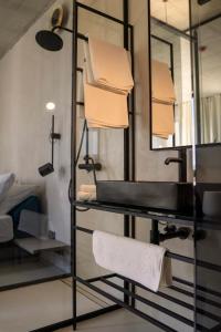 a bathroom with a sink and a mirror at Moro Inn in Korčula