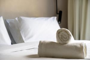 a towel sitting on top of a bed at Moro Inn in Korčula
