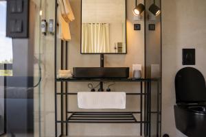 a bathroom with a sink and a mirror at Moro Inn in Korčula