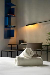 a towel sitting on a bed in a room at Moro Inn in Korčula