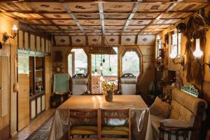 a dining room with a table and chairs at ARTSIV Guesthouse in Dilijan