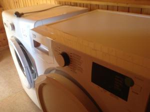 two washing machines are stacked on top of each other at Le p'tit de l'Ecureuil in Sougné-Remouchamps