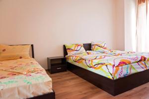 Ліжко або ліжка в номері Guest House Villa Penchevi