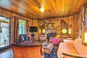 a living room with a couch and a fireplace at Dreamy Homestead Escape Patio, Ranch On-Site in Crossville