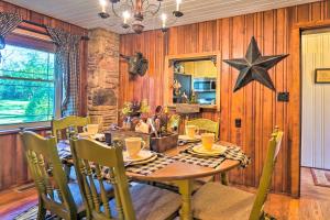 a dining room with a table and a star on the wall at Dreamy Homestead Escape Patio, Ranch On-Site in Crossville
