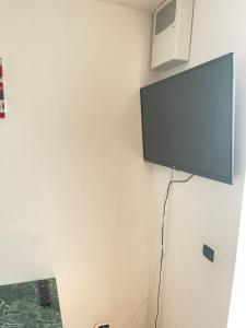 a flat screen tv hanging on a wall at Al Corso in Molfetta
