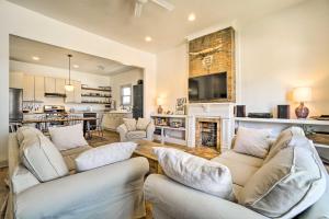 a living room with two couches and a fireplace at Cute Nashville Getaway Walk to Cafes and Pubs! in Nashville