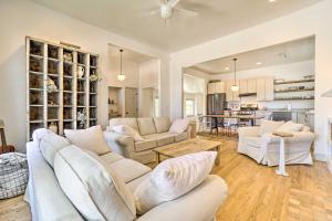 a living room with white furniture and a kitchen at Cute Nashville Getaway Walk to Cafes and Pubs! in Nashville