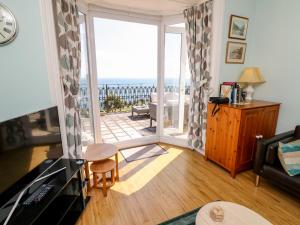 a living room with a view of the ocean at Seaview House in Ventnor