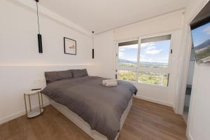 Posteľ alebo postele v izbe v ubytovaní AMAZING APARTMENT WITH STUNNING VIEWS + 37 fotografií