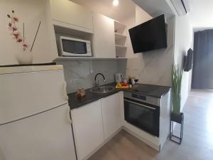Kuchyň nebo kuchyňský kout v ubytování Apartments San Paulo