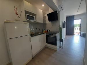 Kuchyň nebo kuchyňský kout v ubytování Apartments San Paulo