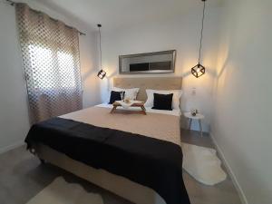 Postel nebo postele na pokoji v ubytování Apartments San Paulo