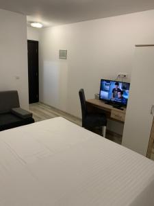 TV a/nebo společenská místnost v ubytování Villa Paradiso By Italy