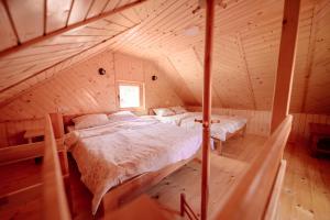 Säng eller sängar i ett rum på Bakalovina House