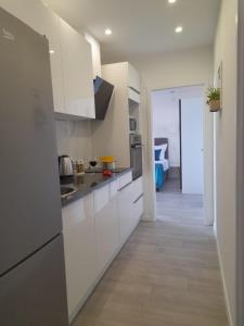 Kuchyň nebo kuchyňský kout v ubytování Apartments San Paulo