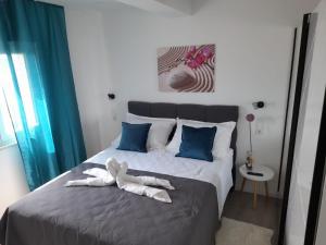 Postel nebo postele na pokoji v ubytování Apartments San Paulo