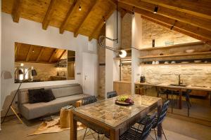 a living room with a table and a couch at History Hvar 1529 in Hvar