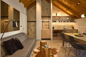 a living room with a couch and a table at History Hvar 1529 in Hvar