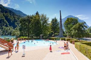a group of people in a swimming pool at Apartment In Allemont in Allemont