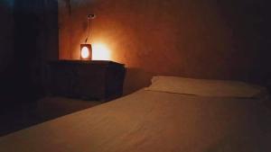 A bed or beds in a room at NaInshal Siwa