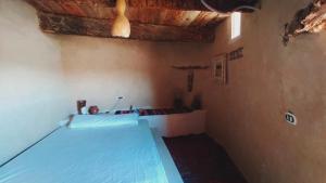 A bed or beds in a room at NaInshal Siwa