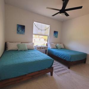 A bed or beds in a room at Blue Door Retreat - Luxury Pool Home - sleeps 8