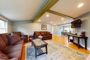 a living room with a couch and a table at The 302 Retreat in Bartlett