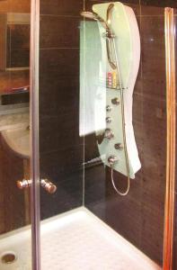 a shower with a glass door next to a toilet at Holiday Home Kaltennordheim - DMG07039-F in Kaltennordheim