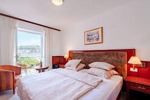 Postel nebo postele na pokoji v ubytování Hotel Dalmacija