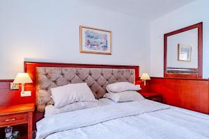 Postel nebo postele na pokoji v ubytování Hotel Dalmacija