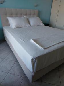 En eller flere senge i et værelse på La Casa Di Nonna