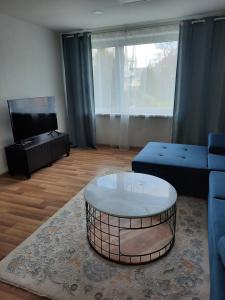 a living room with a couch and a coffee table at apartmán Filloména in Liptovský Mikuláš