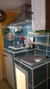 a kitchen with a sink and a counter top at Airport Jackson Loft in Catania