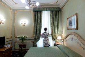 Voodi või voodid majutusasutuse Grand Hotel Wagner toas