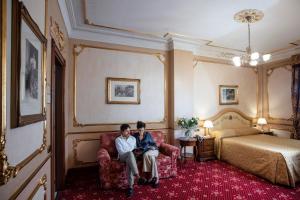 Voodi või voodid majutusasutuse Grand Hotel Wagner toas