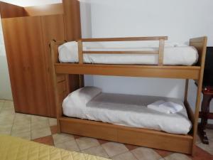 two bunk beds in a room with at Albergo Breglia in Plesio