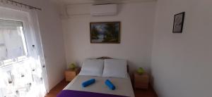 Posteľ alebo postele v izbe v ubytovaní Major apartman