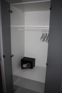 a walk in closet with a radio and utensils at Apartament Skipper in Gdańsk