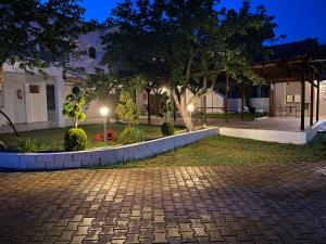 a park at night with lights in the yard at V-Suites 2 in Potos +29 photos